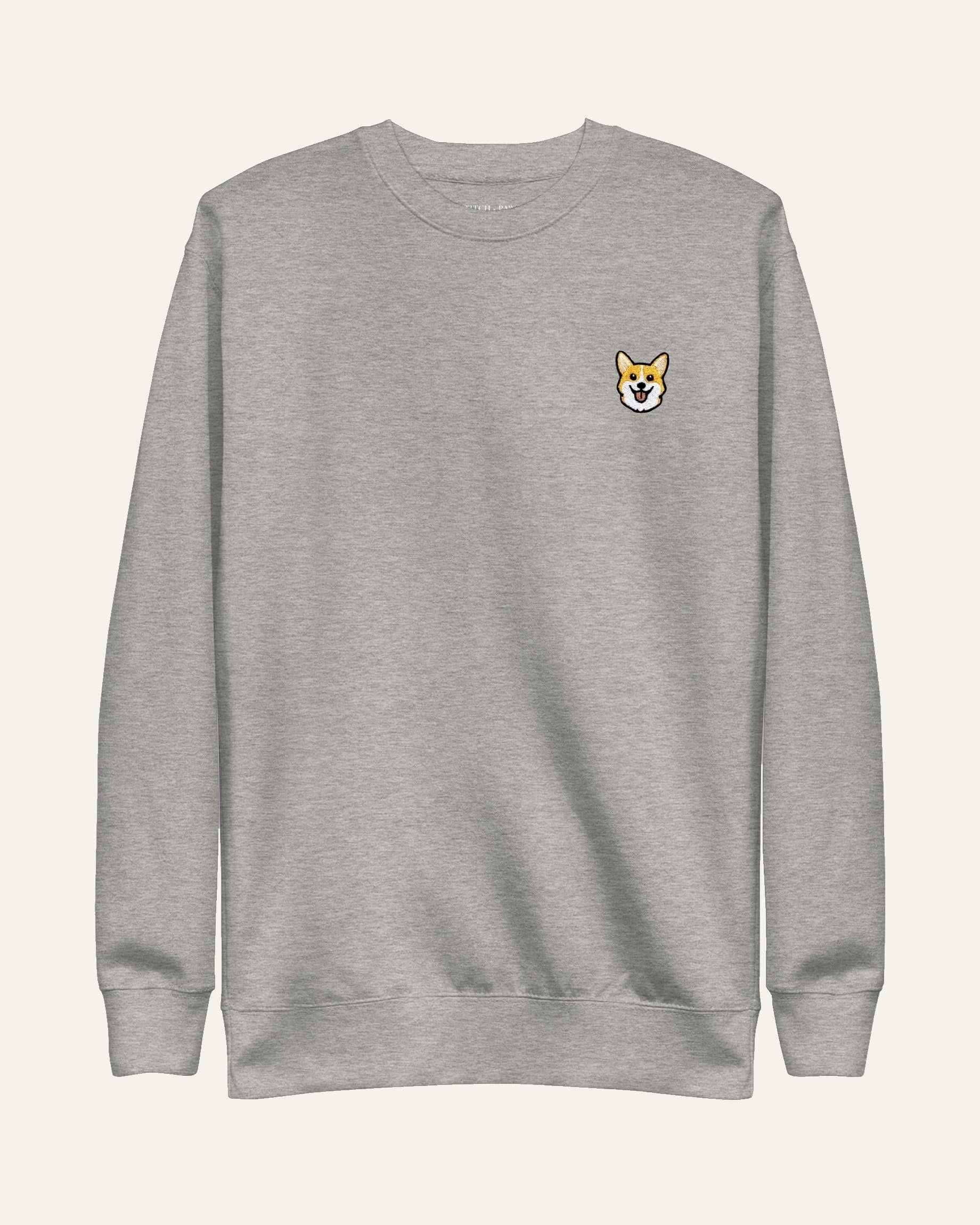 Light Grey Heather Sweatshirt with minimalist embroidered Corgi icon on left chest.