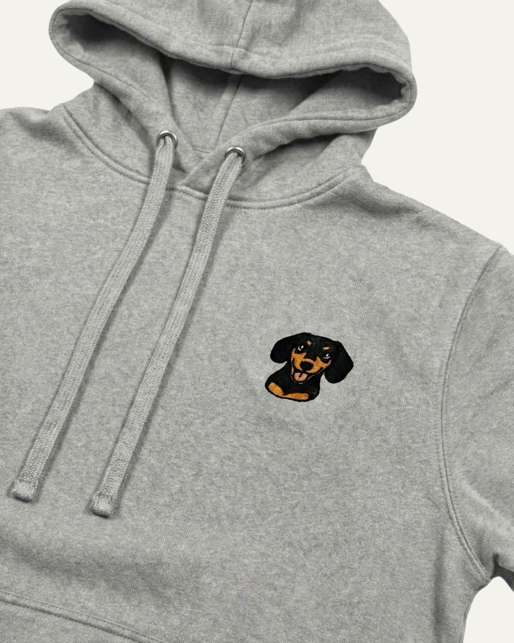 Light Grey Heather Hoodie with minimalist embroidered Dachshund icon on left chest.