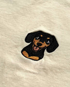 Close-up detail of Dachshund embroidery on Light Beige fabric showing stitch texture.