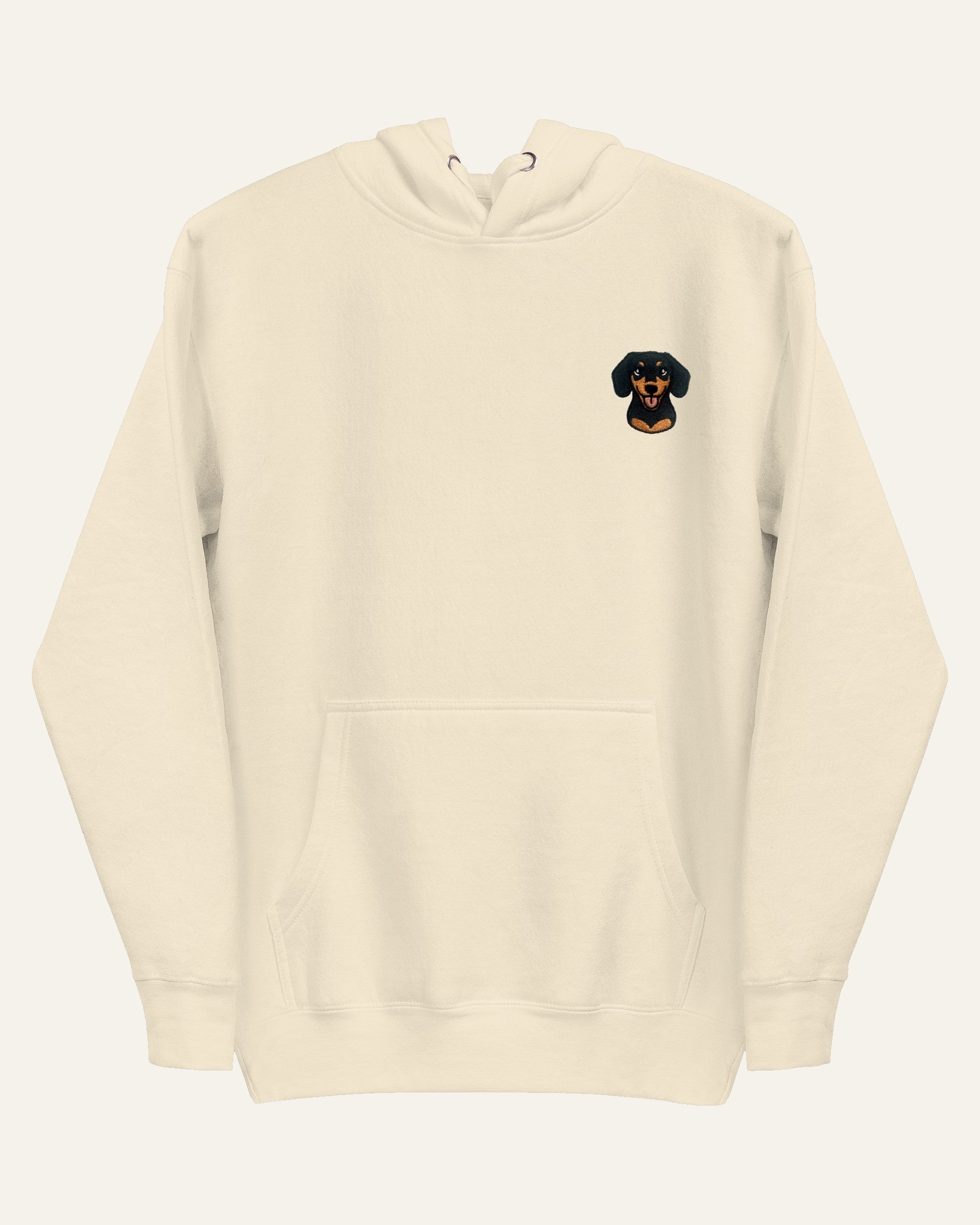 Light Beige Hoodie with minimalist embroidered Dachshund icon on left chest.
