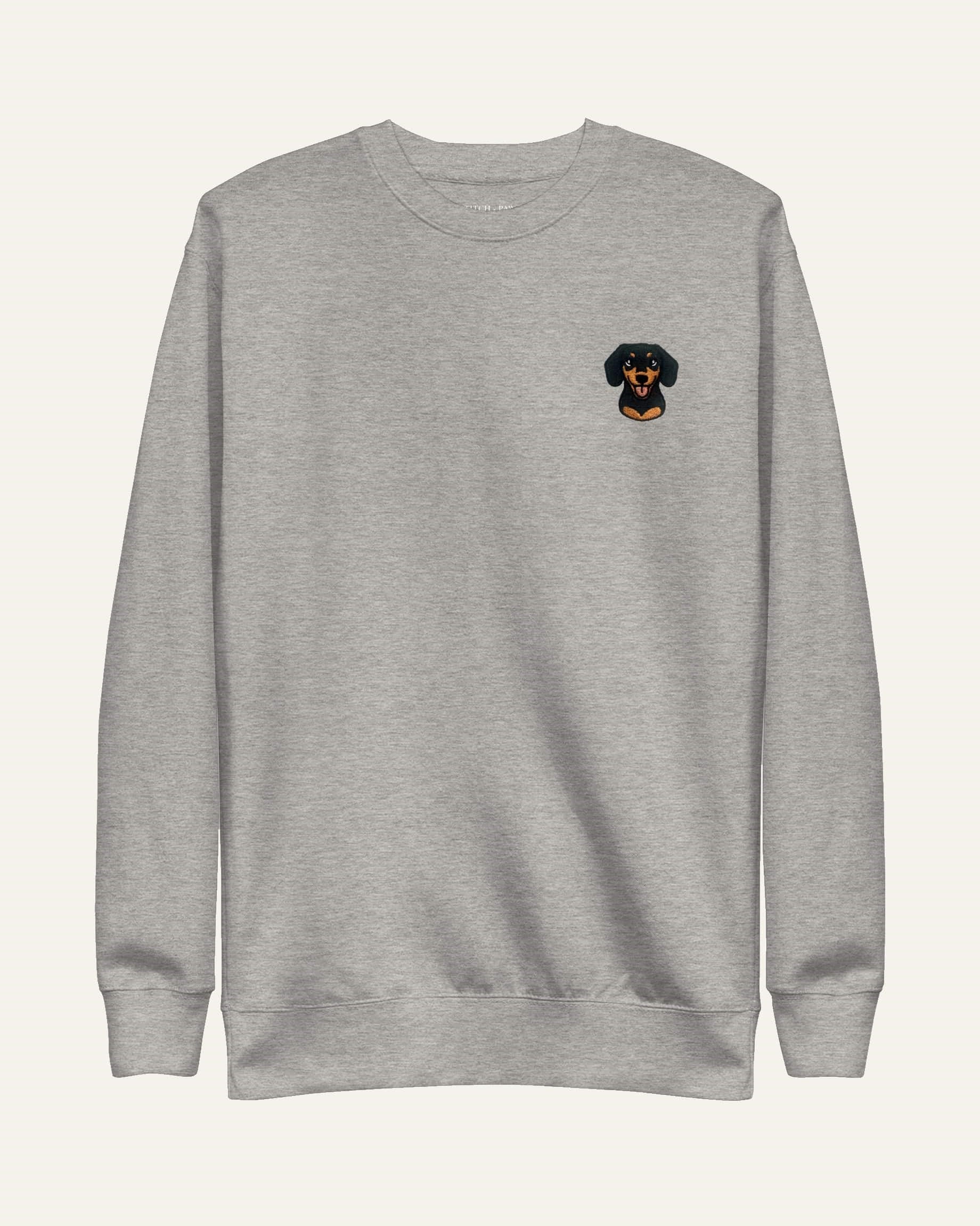 Light Grey Heather Sweatshirt with minimalist embroidered Dachshund icon on left chest.