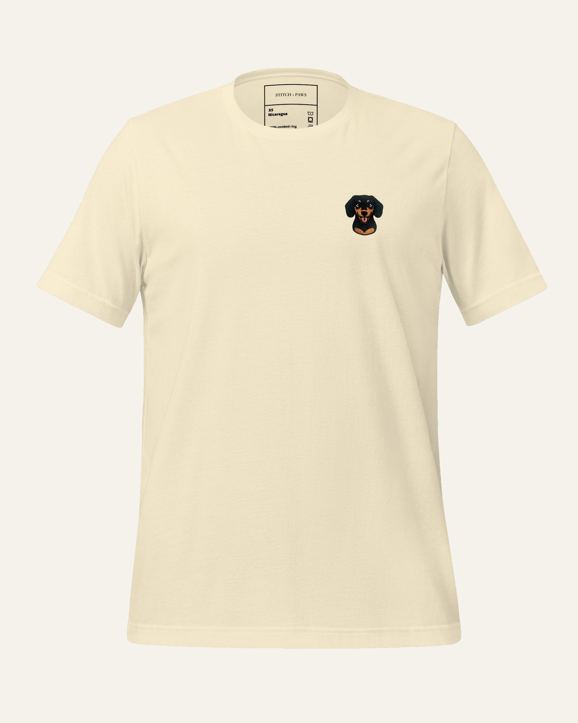 Light Beige T-shirt with minimalist embroidered Dachshund icon on left chest.