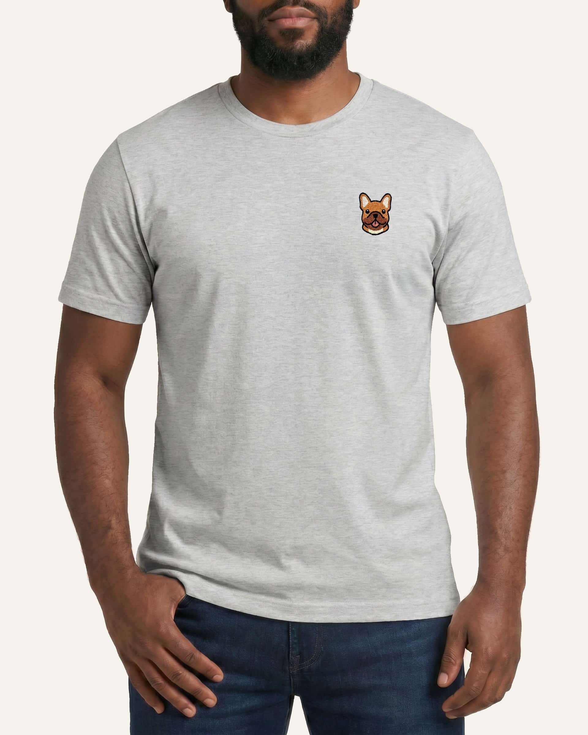 Man wearing Light Grey Heather T-shirt with minimalist embroidered #fawn Frenchie icon on left chest.