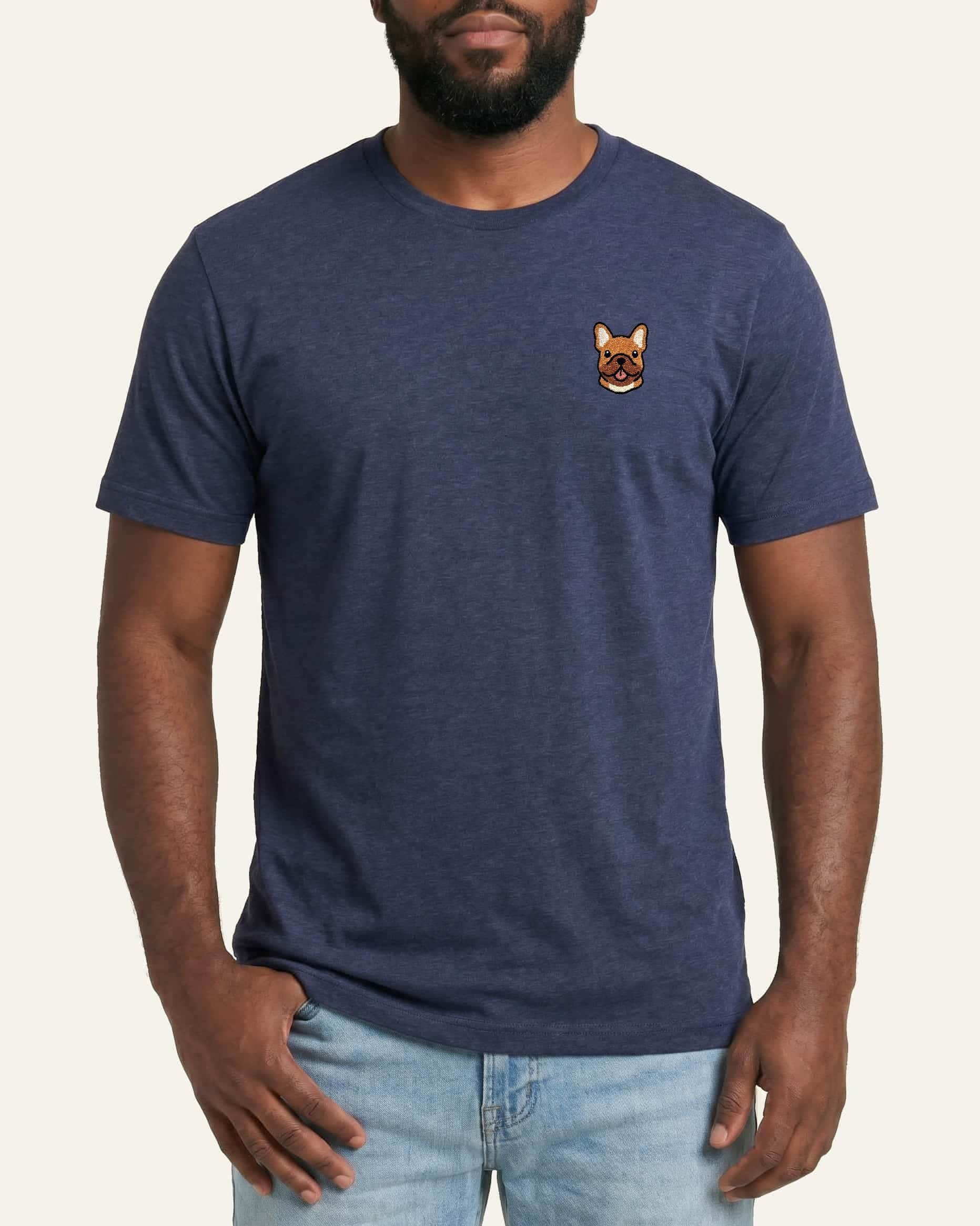 Man wearing Navy Heather T-shirt with minimalist embroidered #fawn Frenchie icon on left chest.