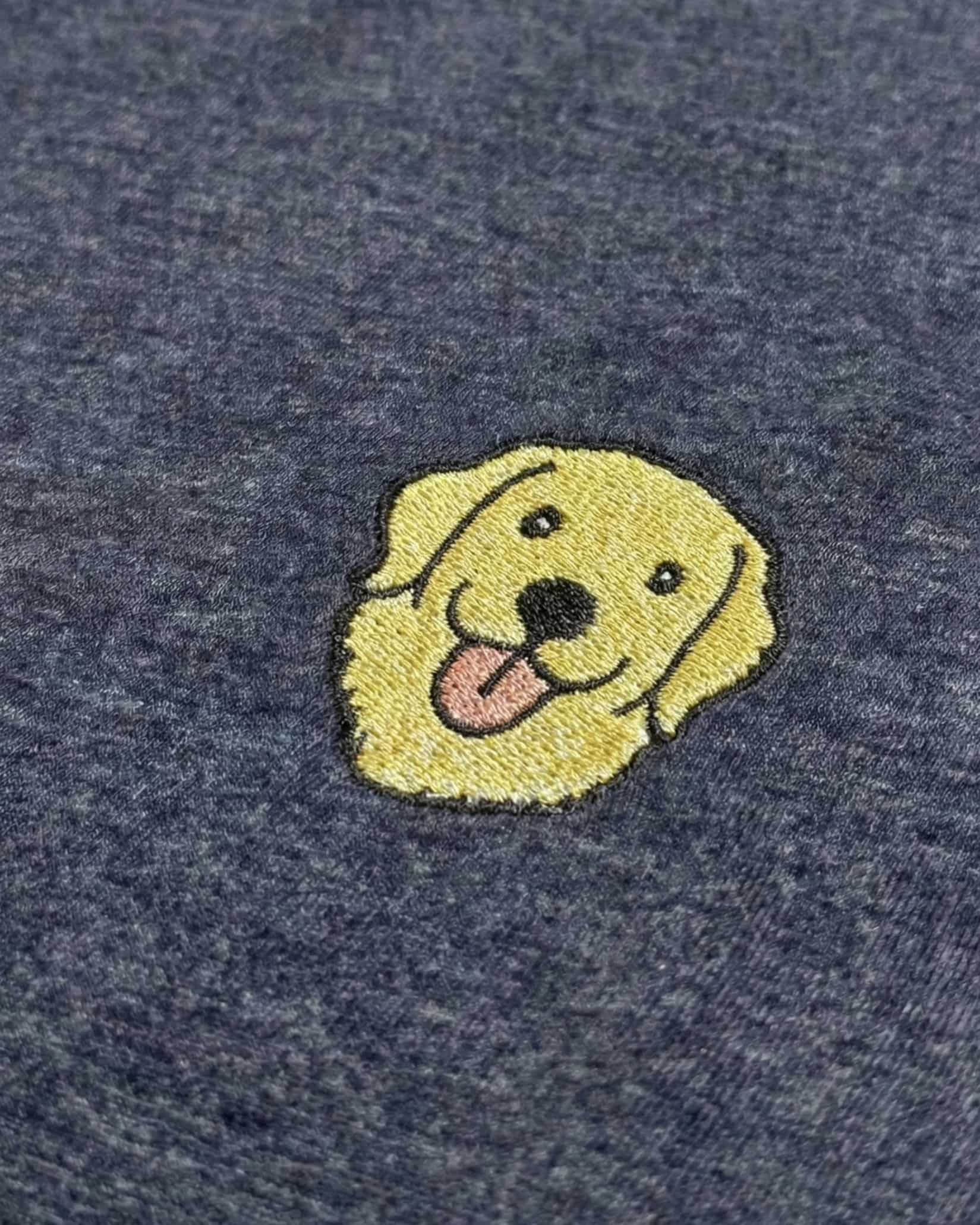 Close-up detail of Golden Retriever embroidery on Navy Heather fabric showing stitch texture.