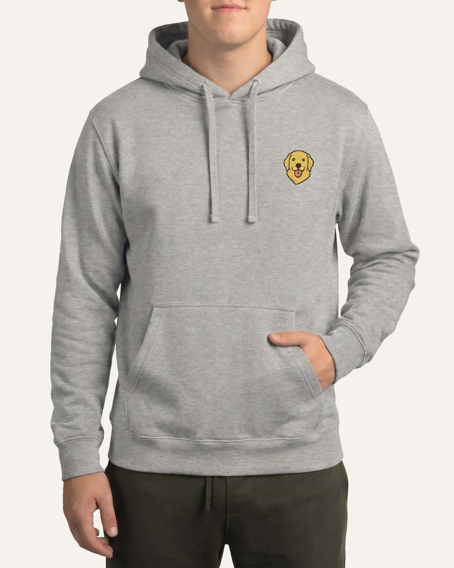 Man wearing Light Grey Heather Hoodie with minimalist embroidered Golden Retriever icon on left chest.