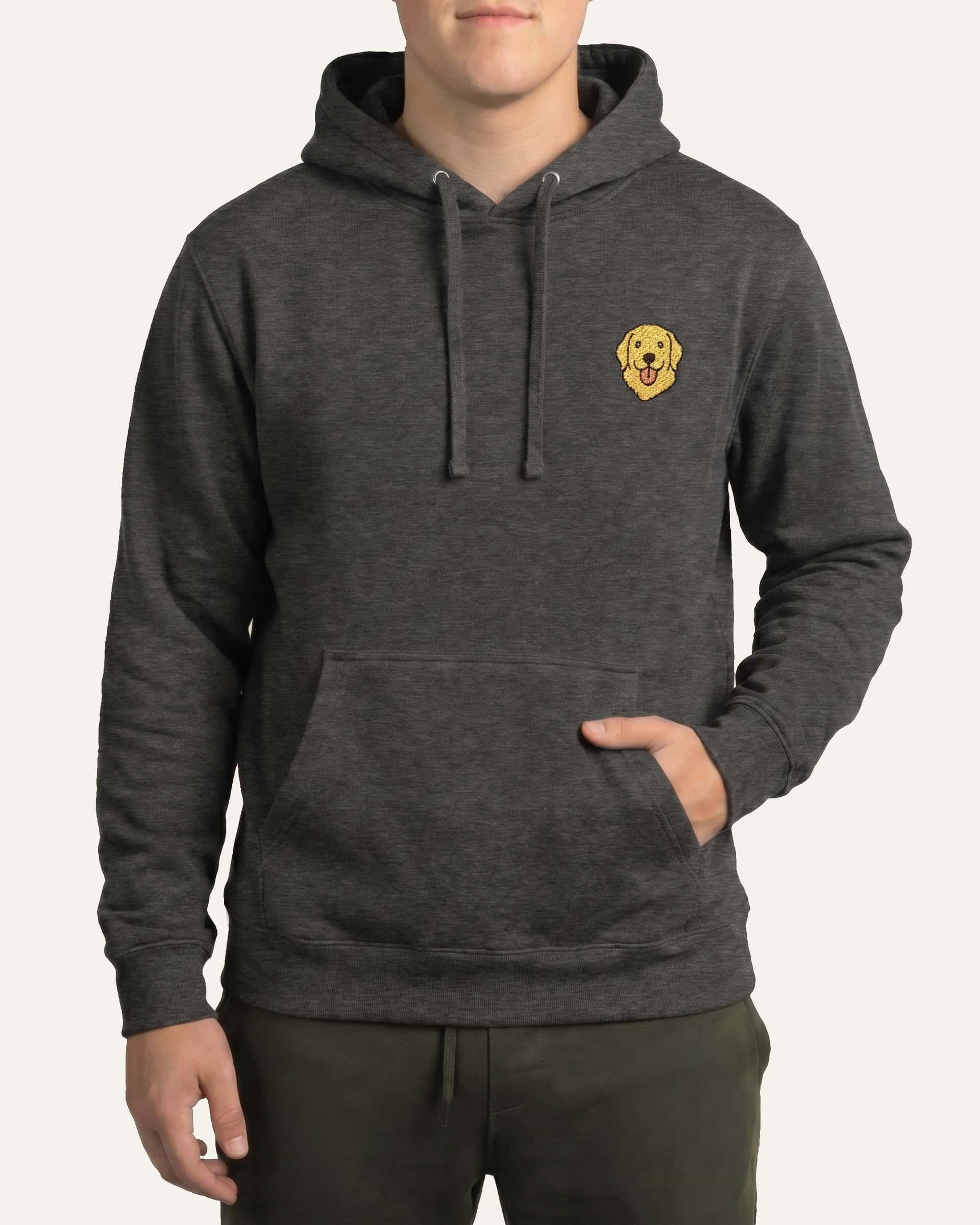 Man wearing Dark Grey Heather Hoodie with minimalist embroidered Golden Retriever icon on left chest.