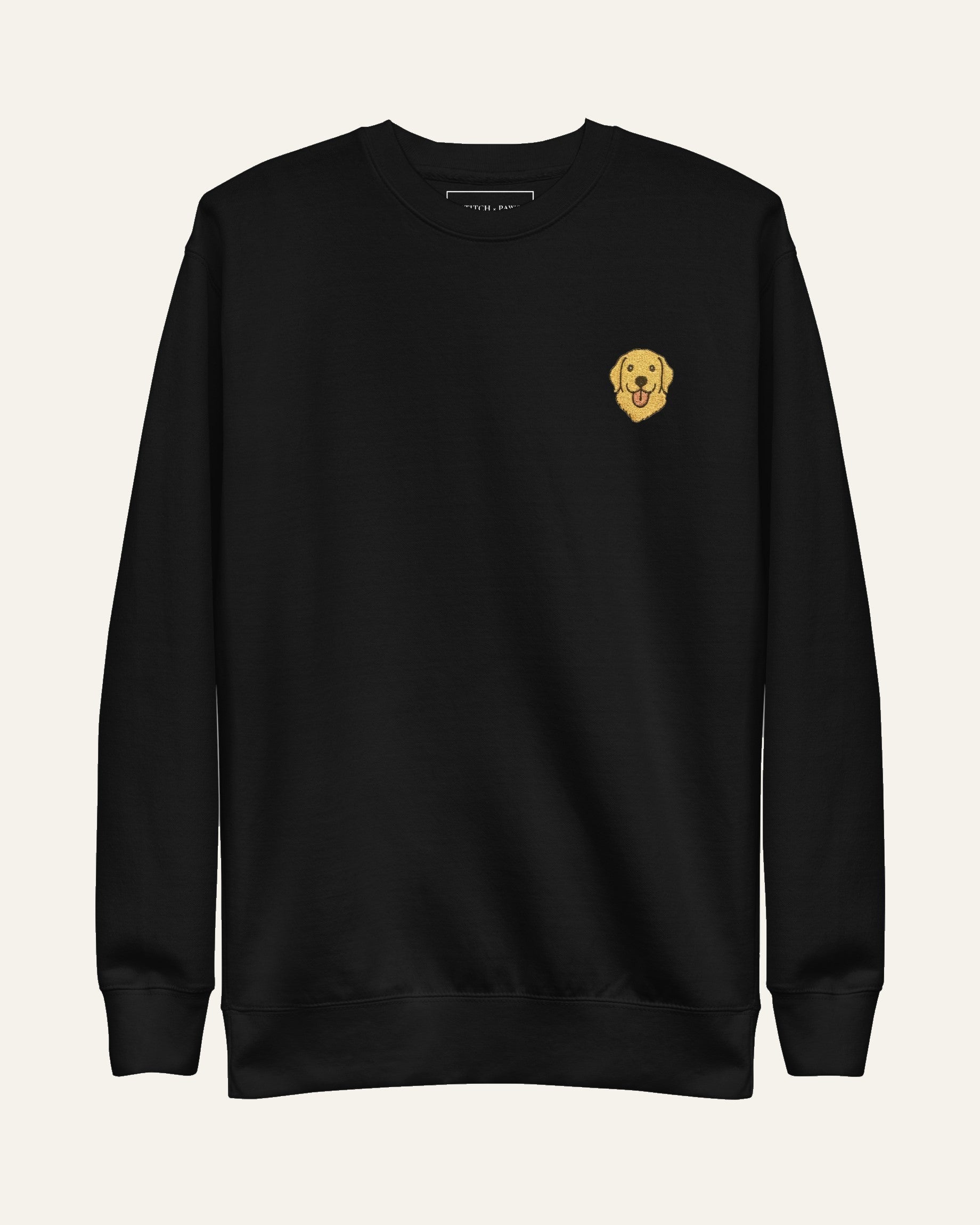 Black Sweatshirt with minimalist embroidered Golden Retriever icon on left chest.