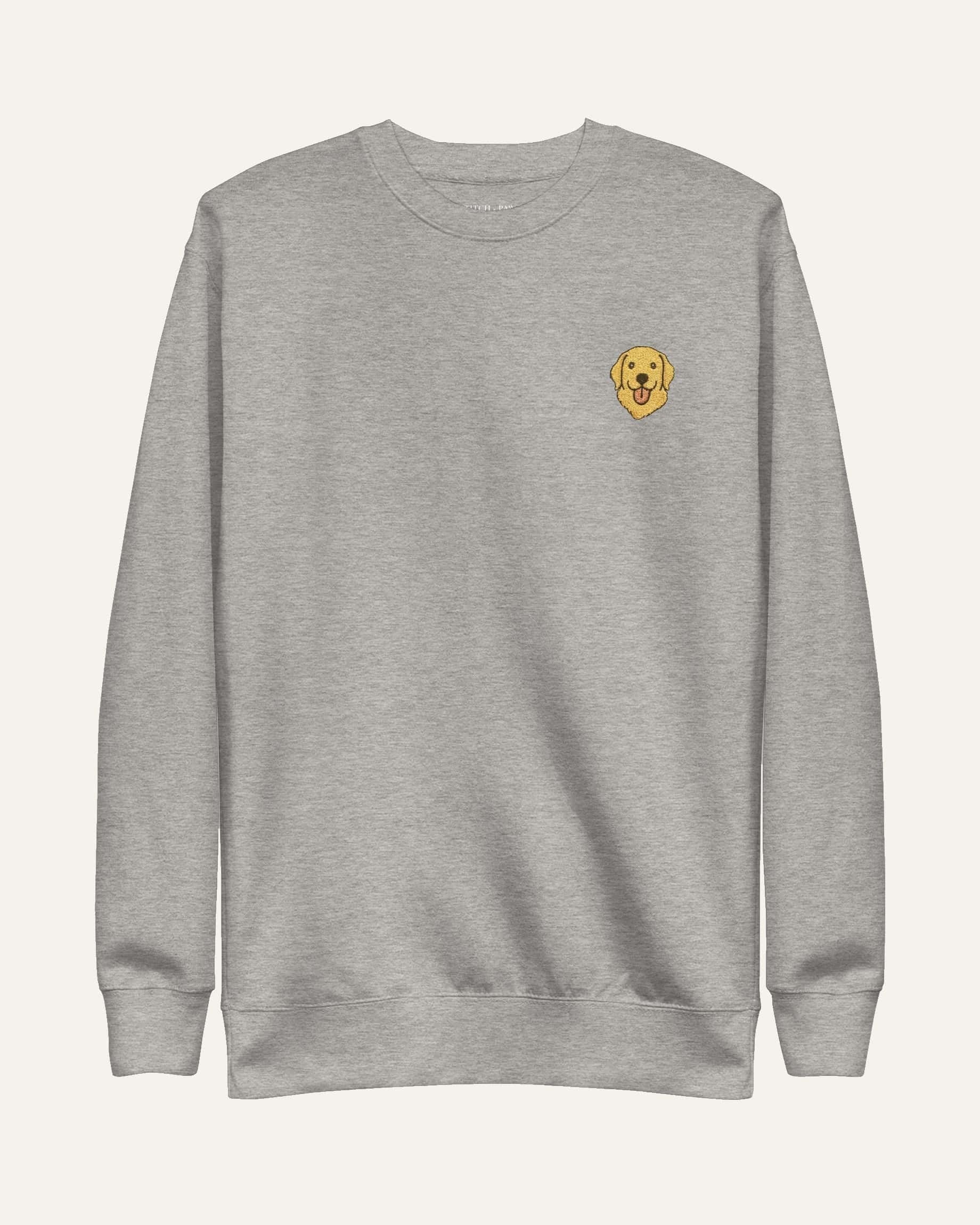 Light Grey Heather Sweatshirt with minimalist embroidered Golden Retriever icon on left chest.