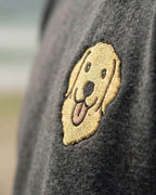 Close-up detail of Golden Retriever embroidery on Dark Grey Heather fabric showing stitch texture.
