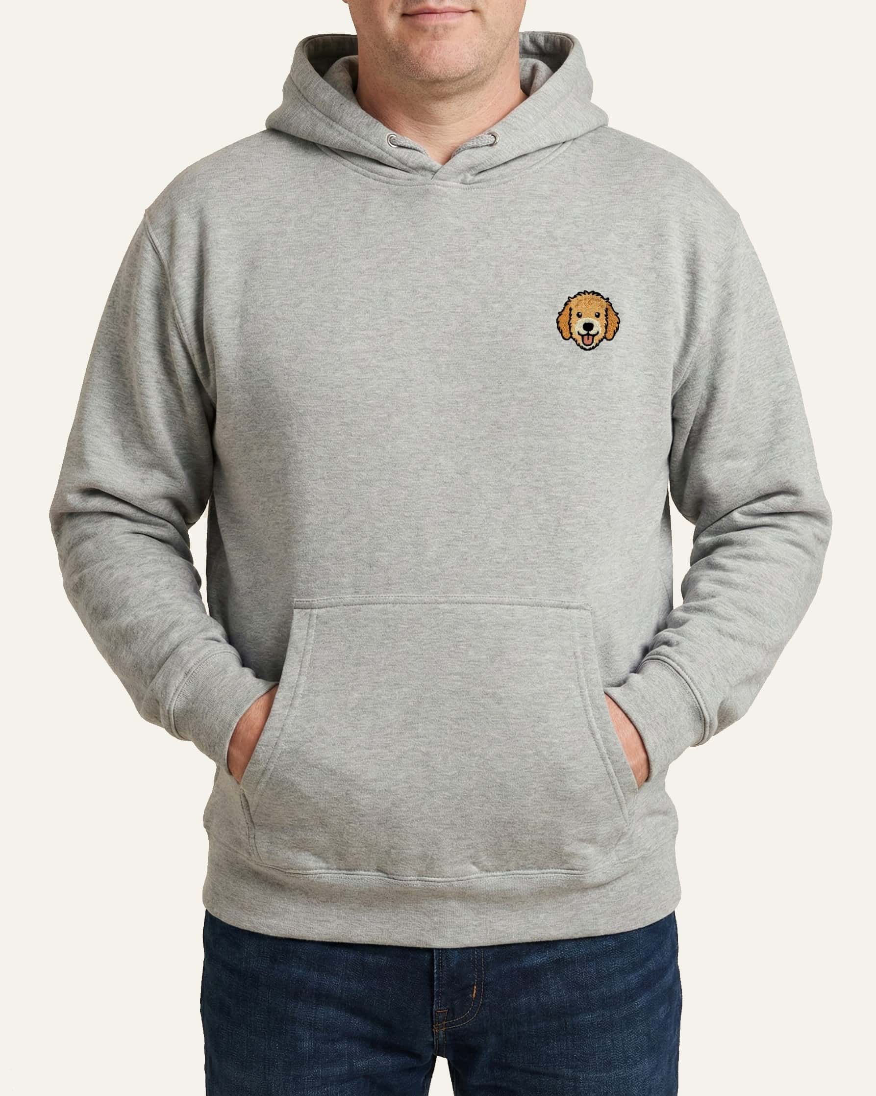 Man wearing Light Grey Heather Hoodie with minimalist embroidered Goldendoodle icon on left chest.