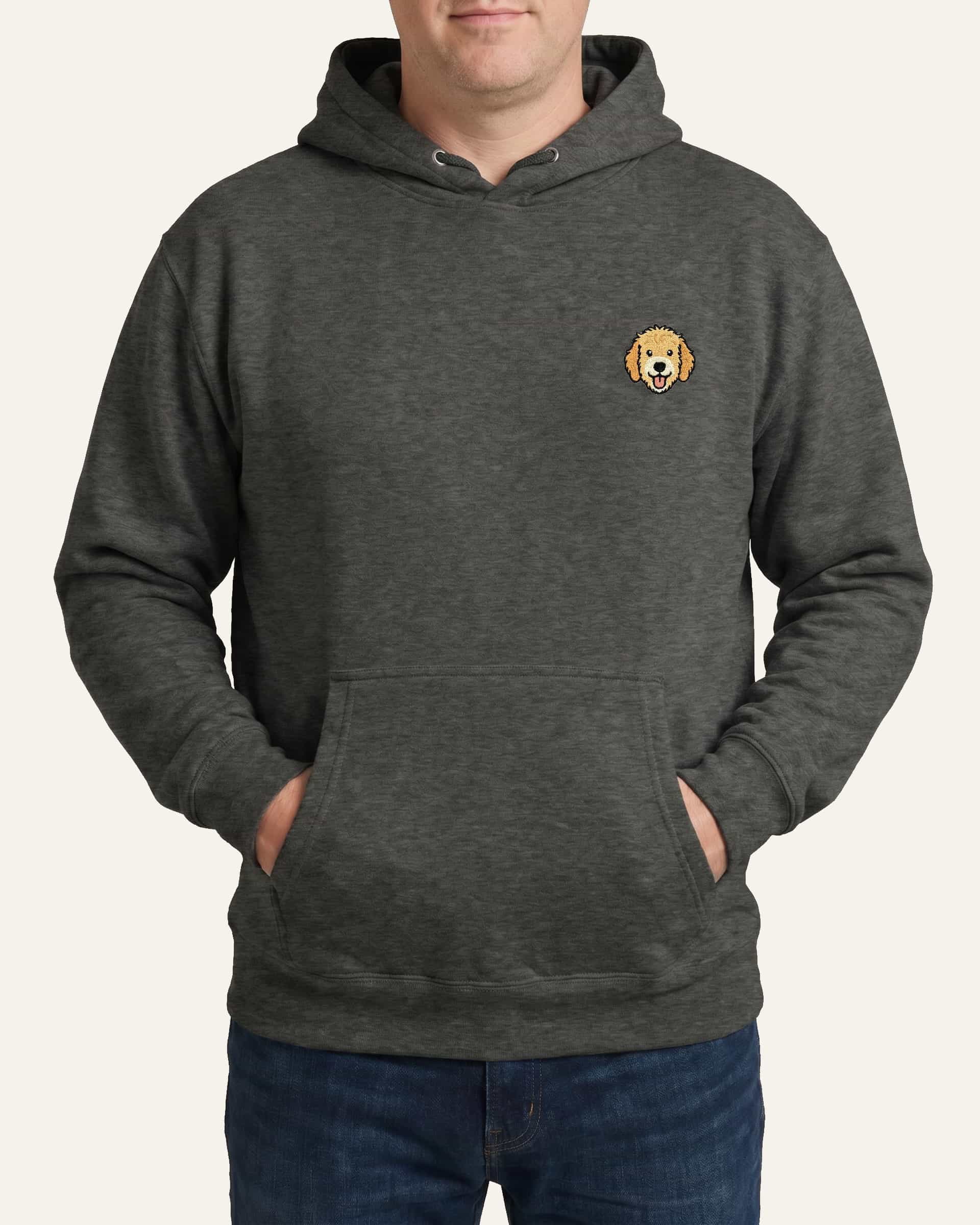Man wearing Dark Grey Heather Hoodie with minimalist embroidered Goldendoodle icon on left chest.