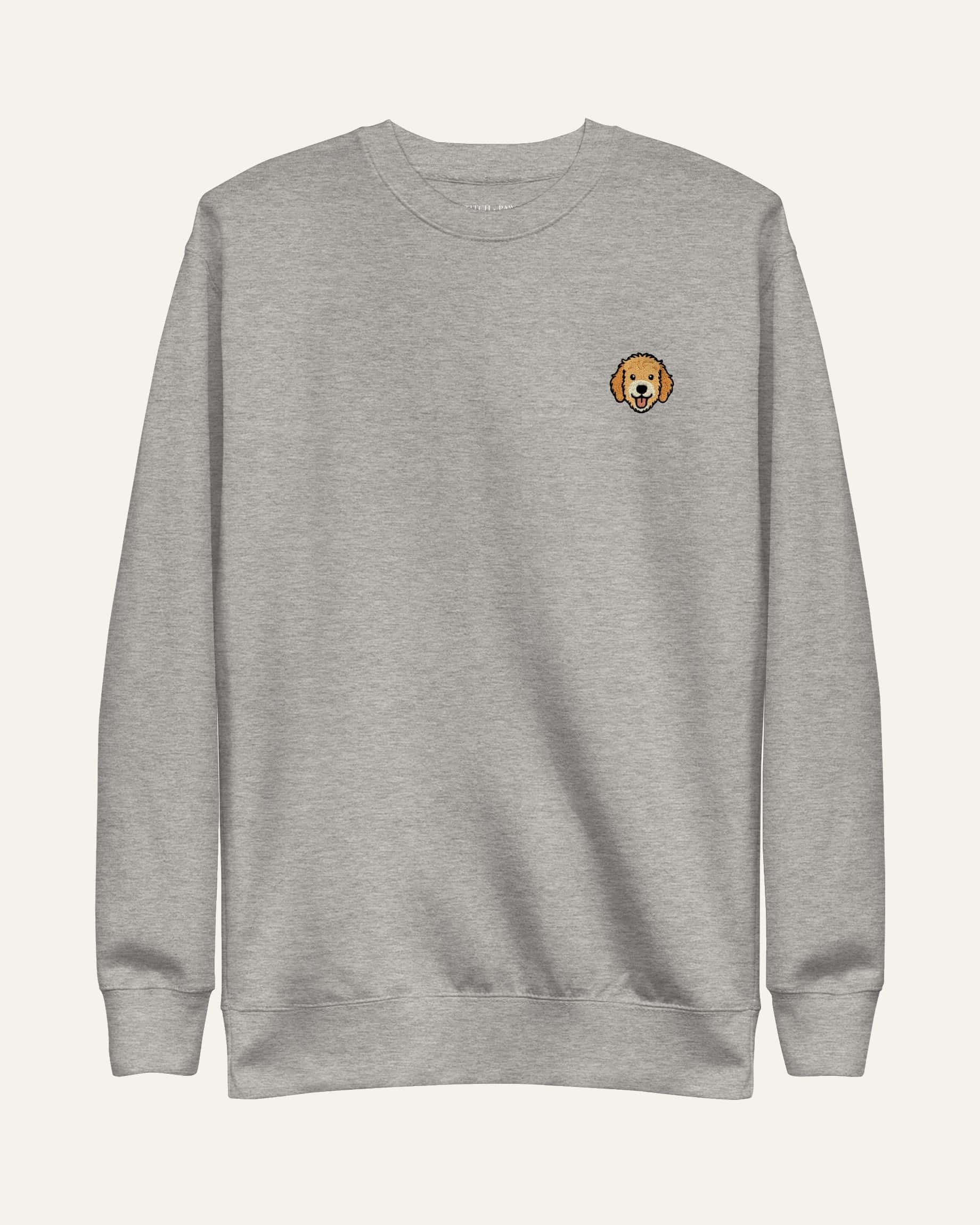 Light Grey Heather Sweatshirt with minimalist embroidered Goldendoodle icon on left chest.
