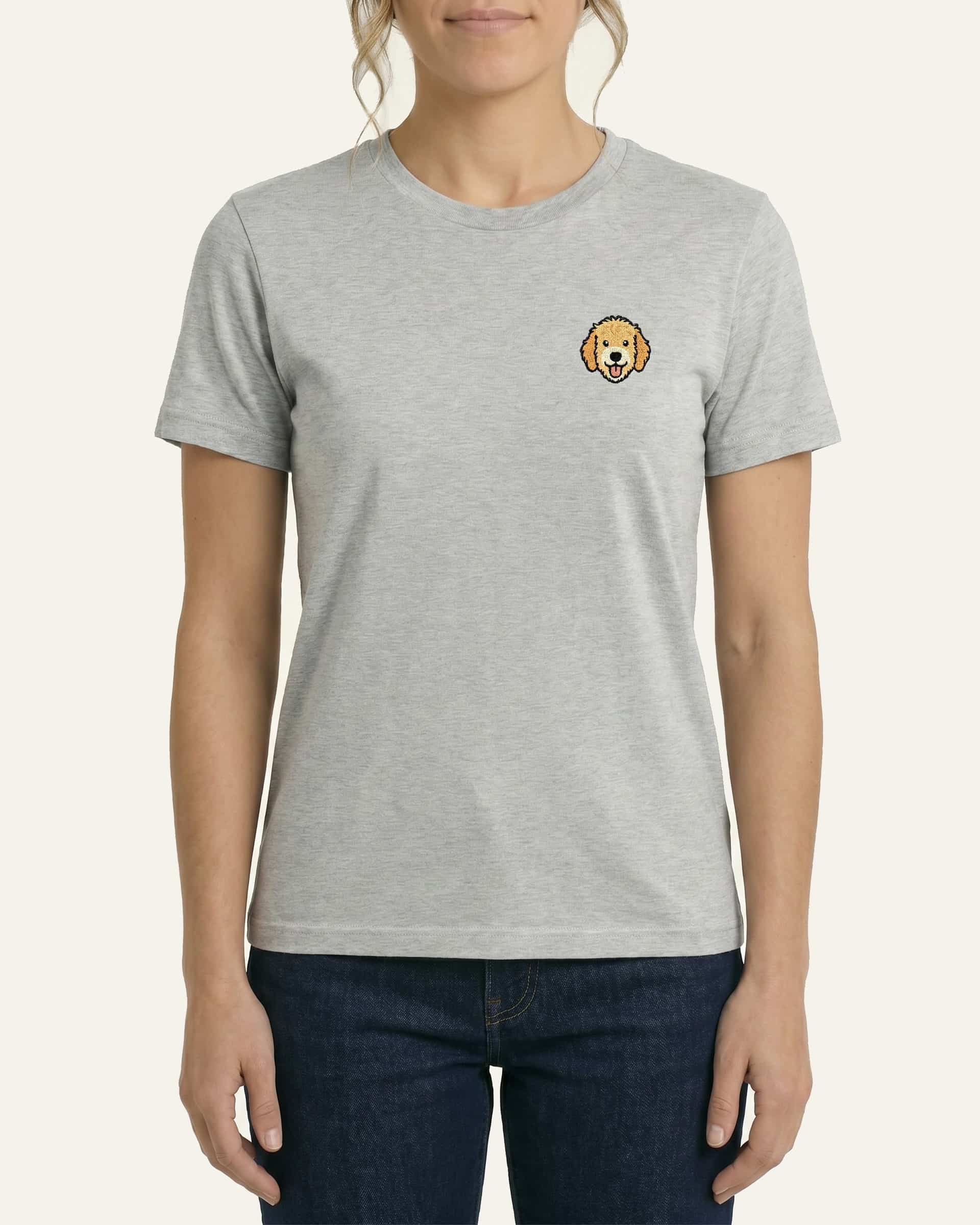 Woman wearing Light Grey Heather T-shirt with minimalist embroidered Goldendoodle icon on left chest.