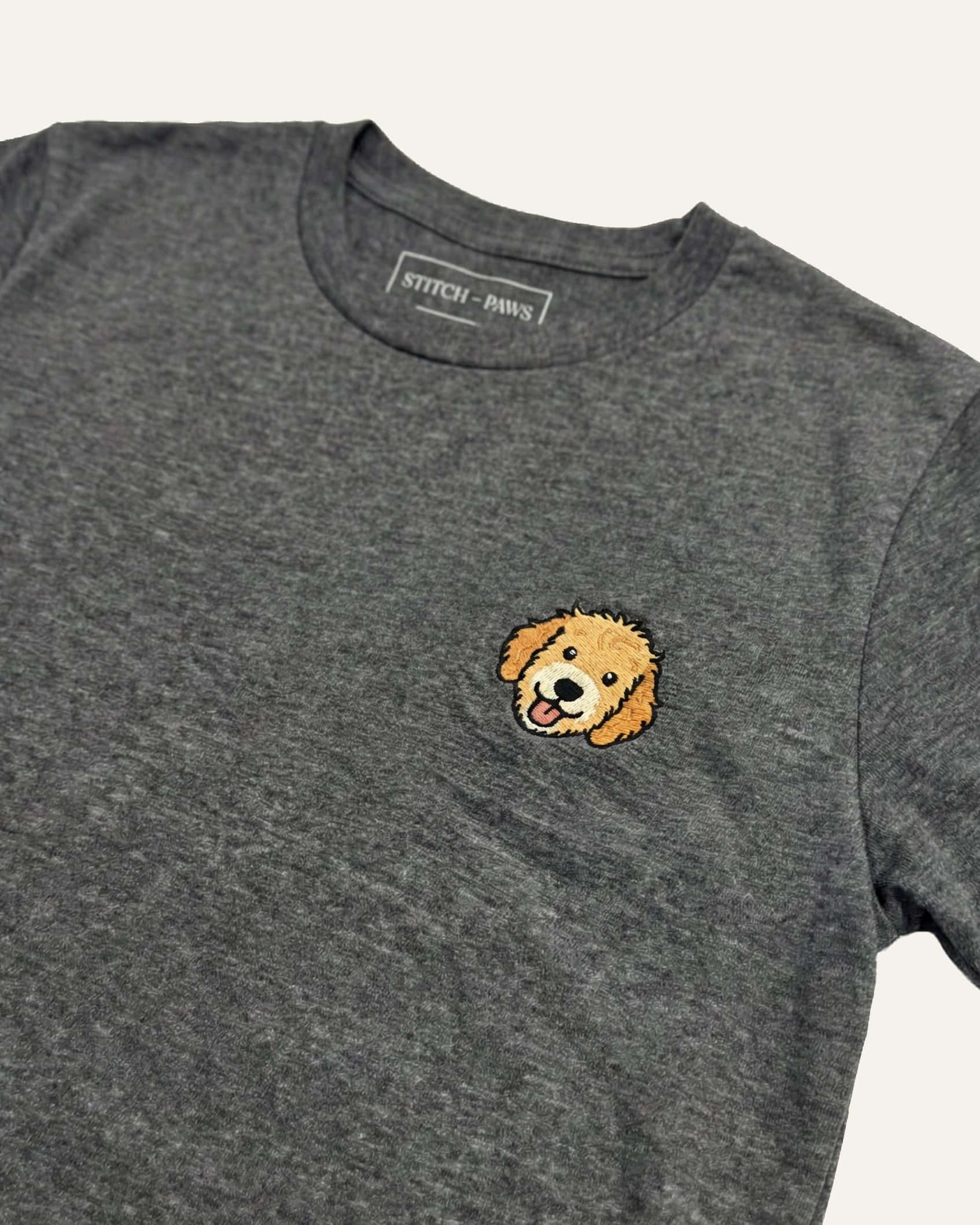 Close up of Dark Grey Heather T-shirt with minimalist embroidered Goldendoodle icon on left chest.