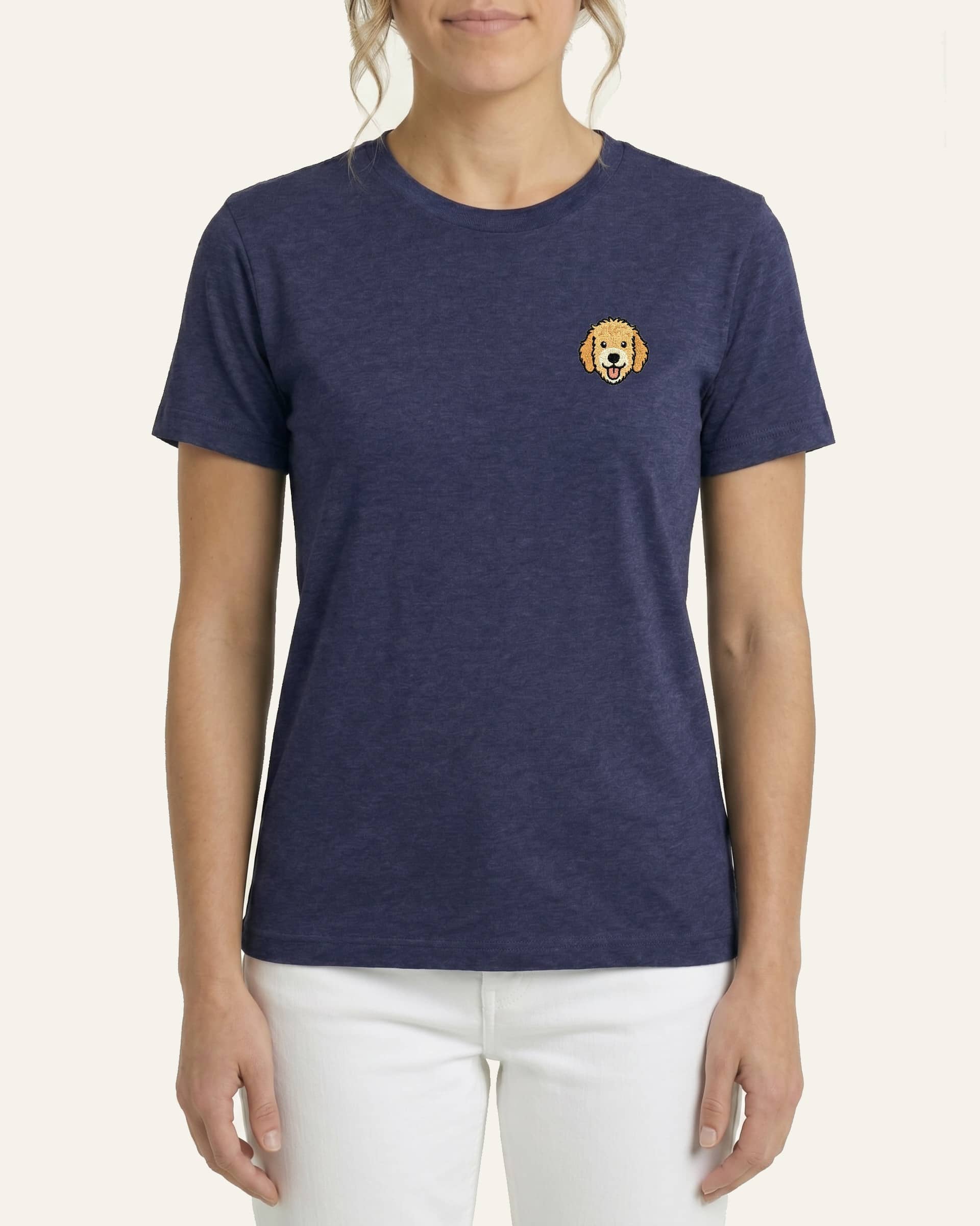 Woman wearing Navy Heather T-shirt with minimalist embroidered Goldendoodle icon on left chest.