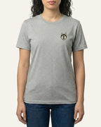 Woman wearing Light Grey Heather T-shirt with minimalist embroidered Husky icon on left chest.