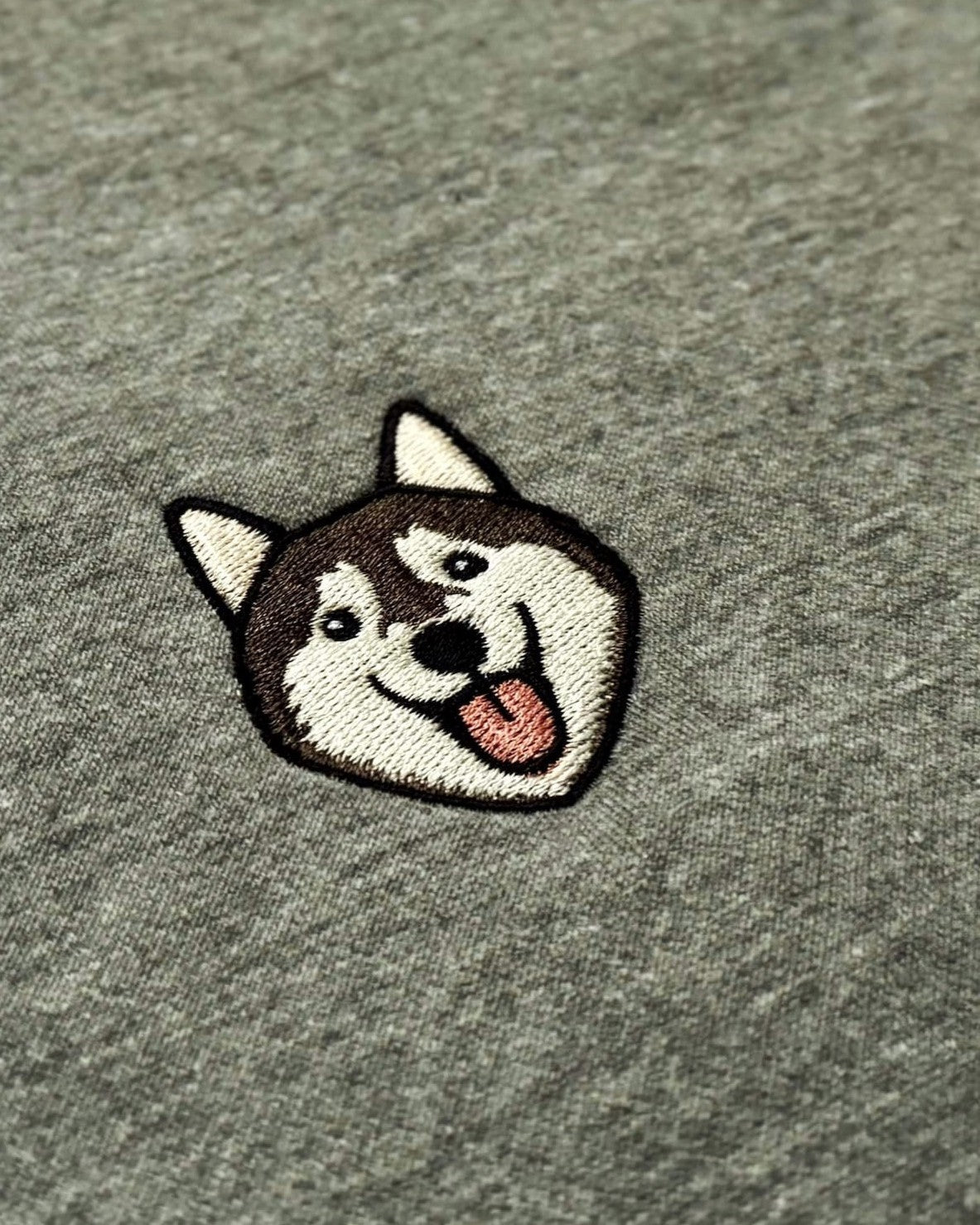 Close-up detail of Husky embroidery on Light Grey fabric showing stitch texture.