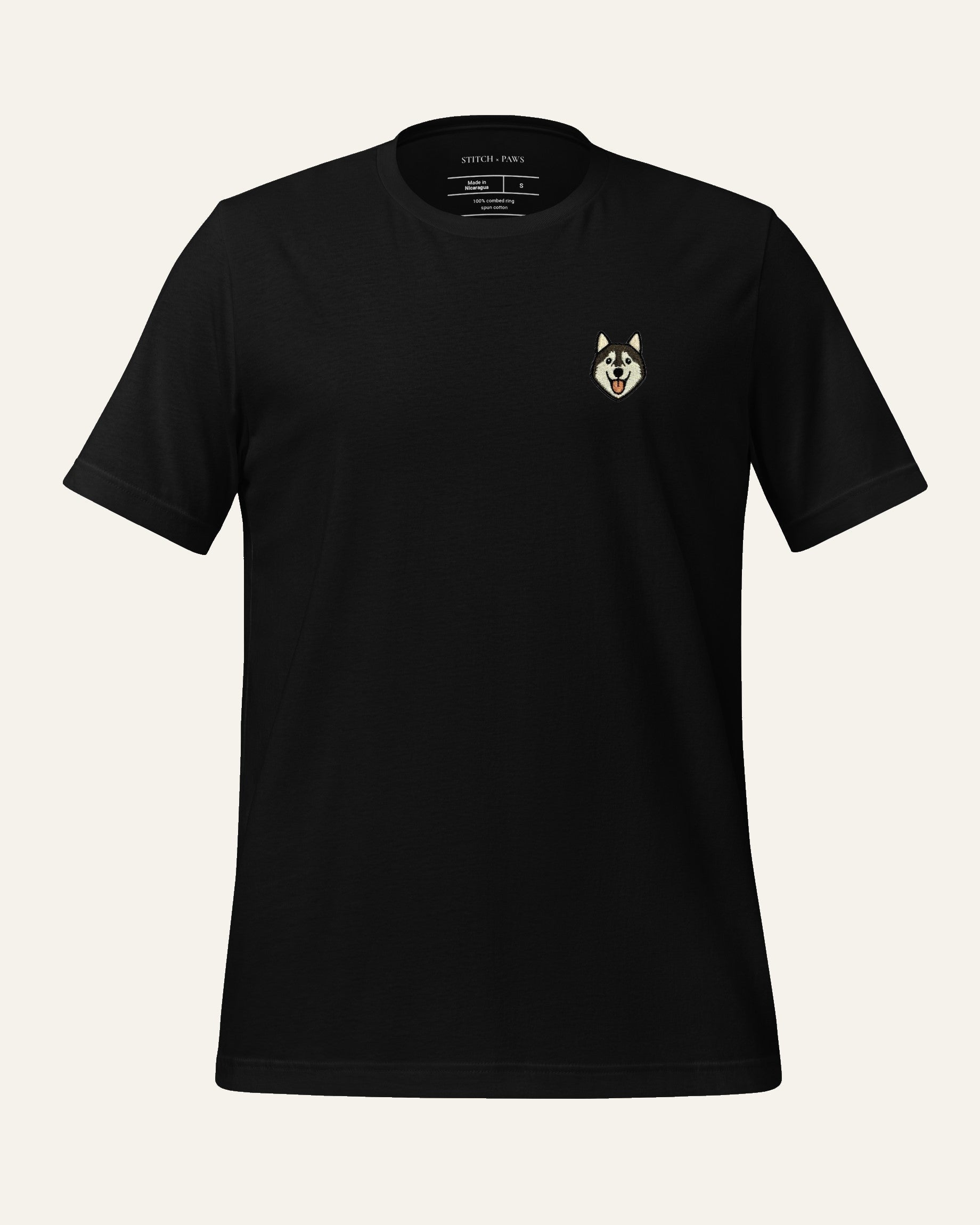 Black T-shirt with minimalist embroidered Husky icon on left chest.