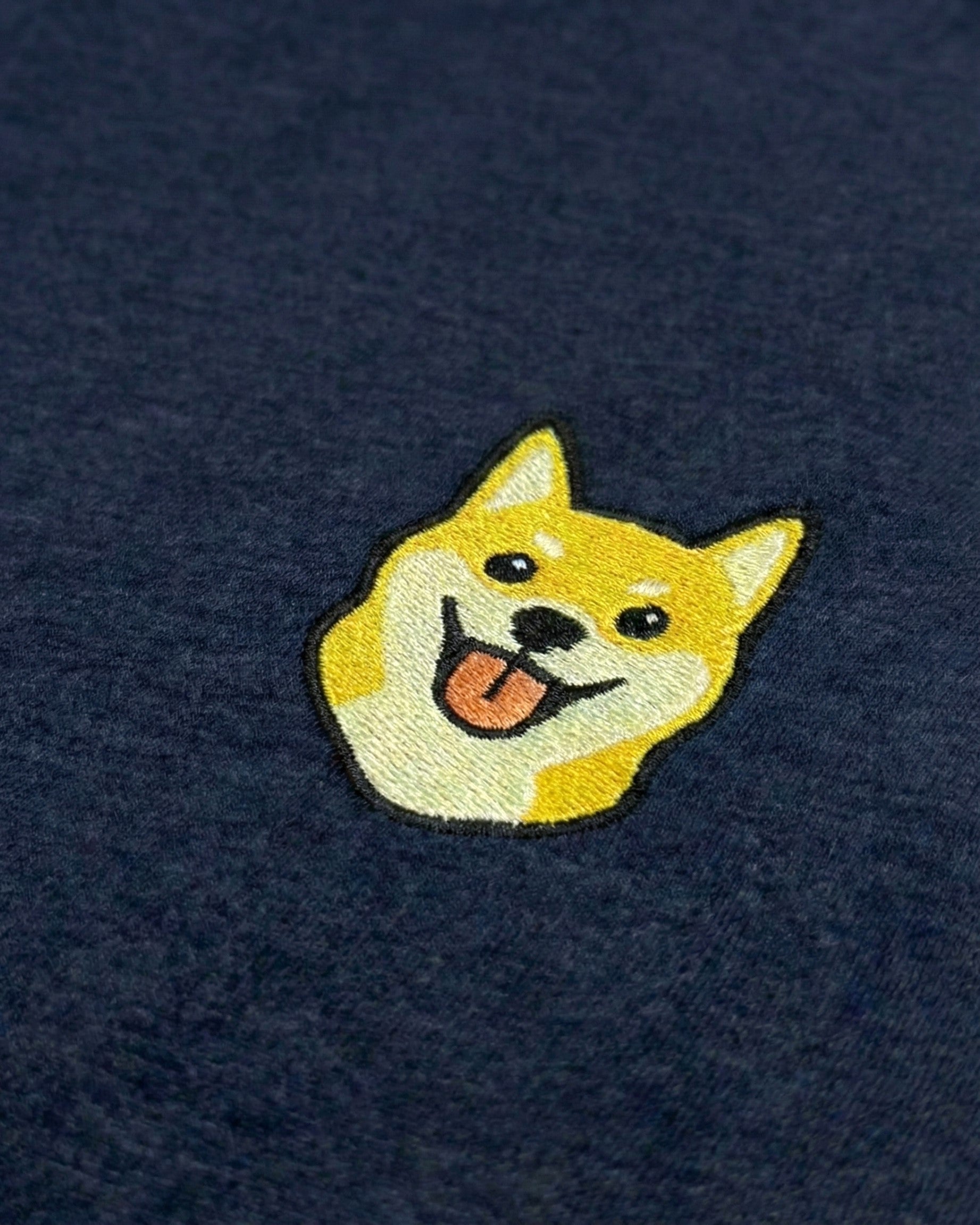 Close-up detail of Shiba Inu embroidery on Navy fabric showing stitch texture.