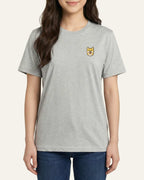 Woman wearing Light Grey Heather T-shirt with minimalist embroidered Shiba Inu icon on left chest.