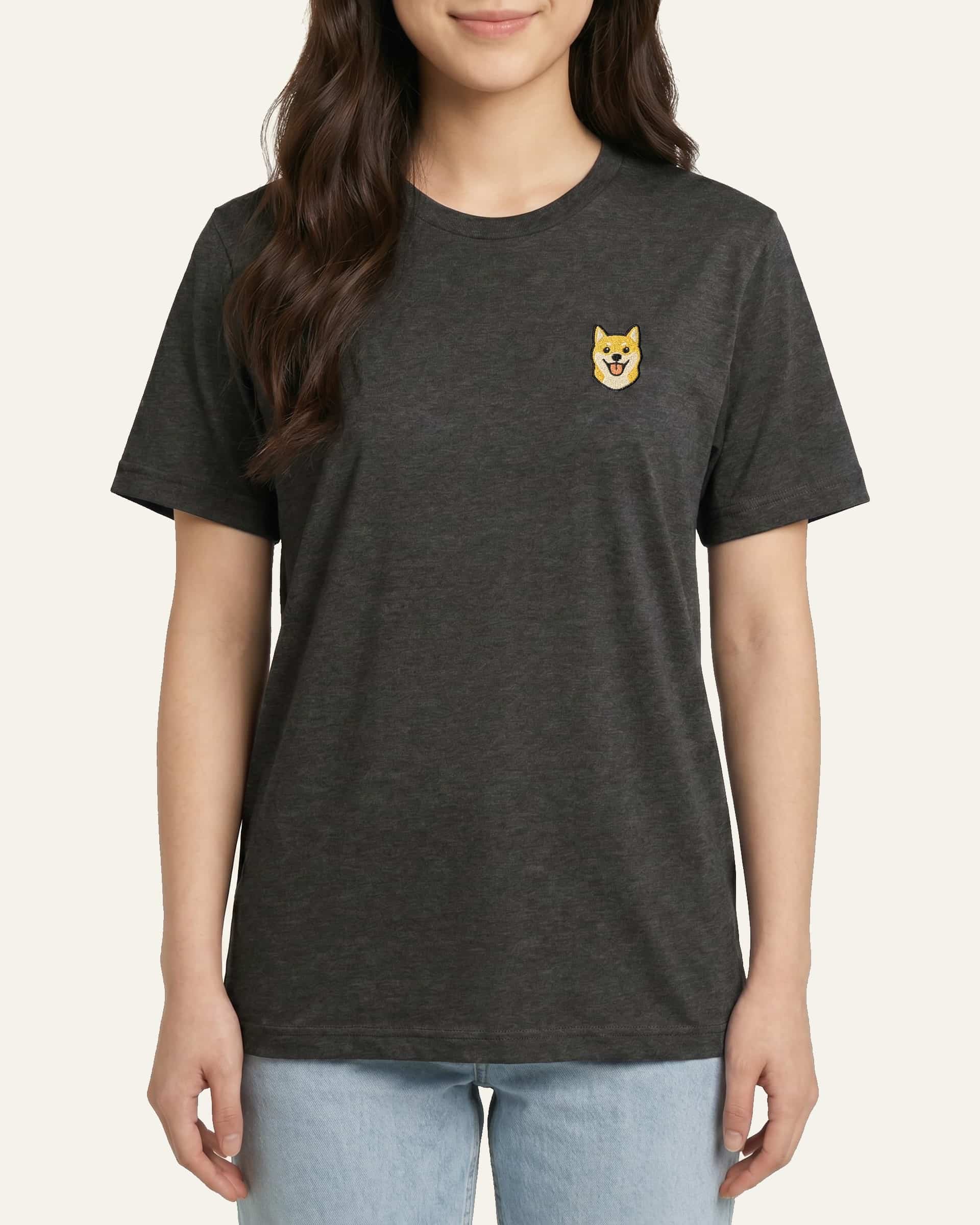 Woman wearing Dark Grey Heather T-shirt with minimalist embroidered Shiba Inu icon on left chest.